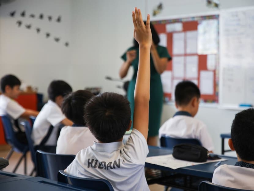 A student raising his hand to answer a question posed by the teacher in a Gifted Education Programme (GEP) class at St. Hilda's Primary School on 28 Aug, 2024. A student raising his hand to answer a question posed by the teacher in a Gifted Education Programme (GEP) class at St. Hilda's Primary School on 28 Aug, 2024.