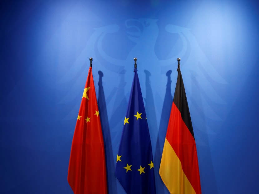 The Chinese, European Union (EU) and German national flags at the Chancellery in Berlin, Germany. The abolition of the two-term limit for the Chinese presidency, which could make Mr Xi Jinping China’s ruler for life, has punctured hope that China would become “a responsible stakeholder” in the global order. Photo: Reuters