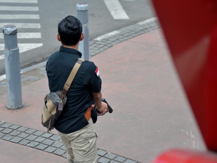 Seven dead in Jakarta blasts, gunfight