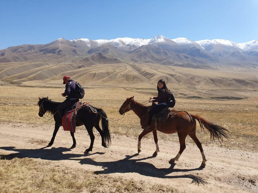 The author travelled on horseback across two days to reach Song Kul, a lake nestled in a valley in Kyrgyzstan.