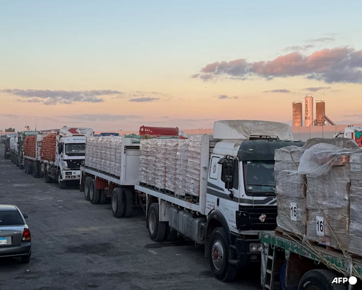 Aid trucks roll into Gaza as dispute over hostage bodies pauses 