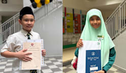 Dua murid cemerlang ini antara 99.1% pelajar madrasah yang lulus PSLE