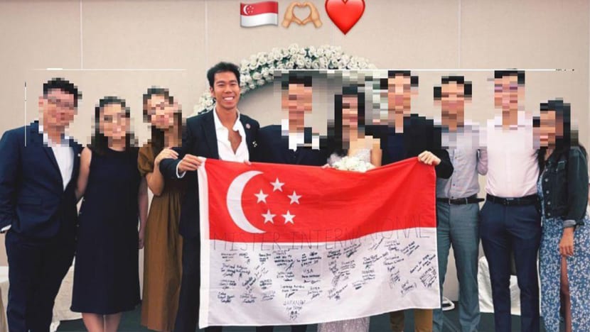 #trending: Photo of Mister Singapore with national flag that had scribbles raises eyebrows