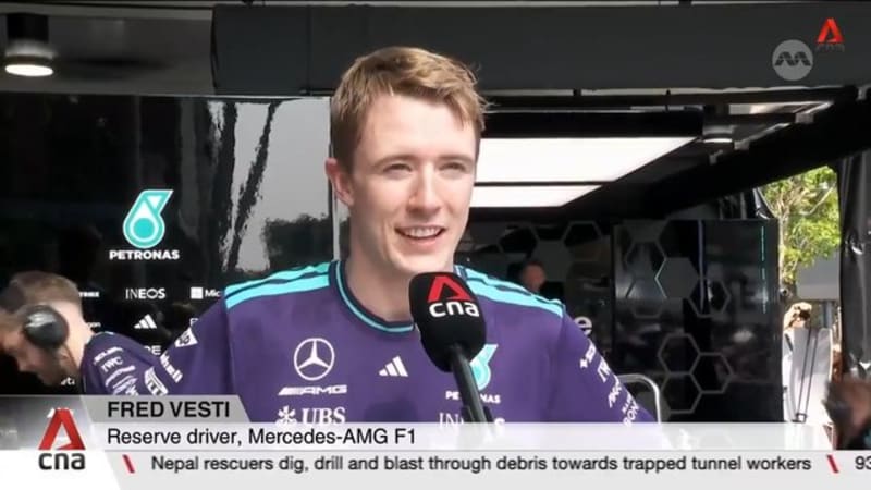 Mercedes reserve driver Fred Vesti races down Orchard Road as part of motorsport festival