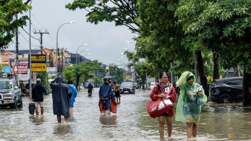 Bali floods kill 14, search continues for two missing