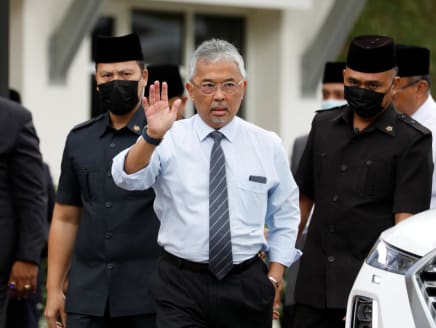 Malaysian King Sultan Abdullah Sultan Ahmad Shah waves to media members waiting outside the National Palace in Kuala Lumpur, Malaysia on Nov 21, 2022. 