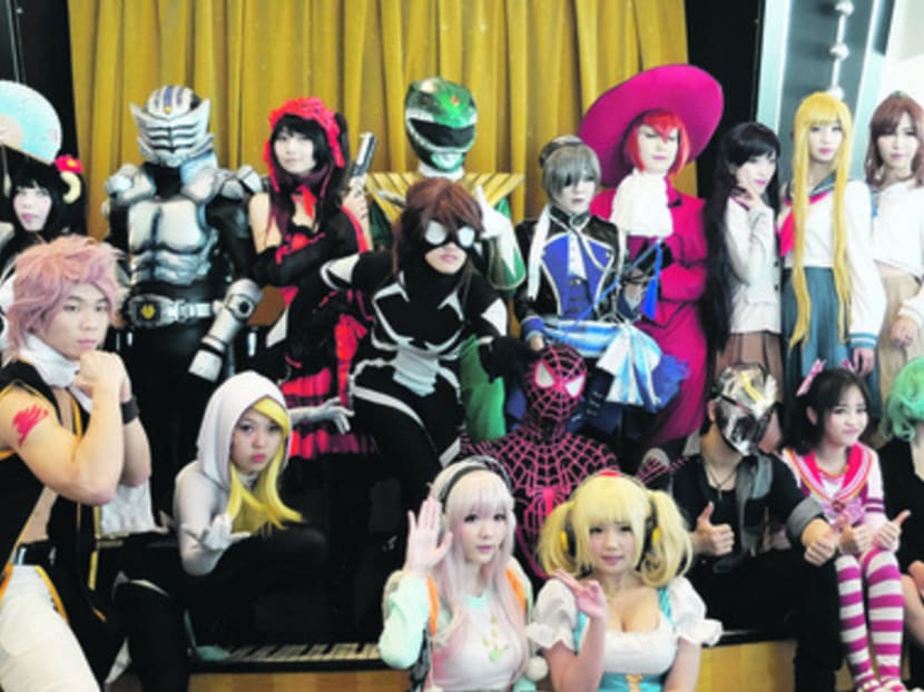 The 24 contestants and four celebrity cosplayers strike a pose for the CosFest Sea event. Photo: Royal Caribbean Cruises