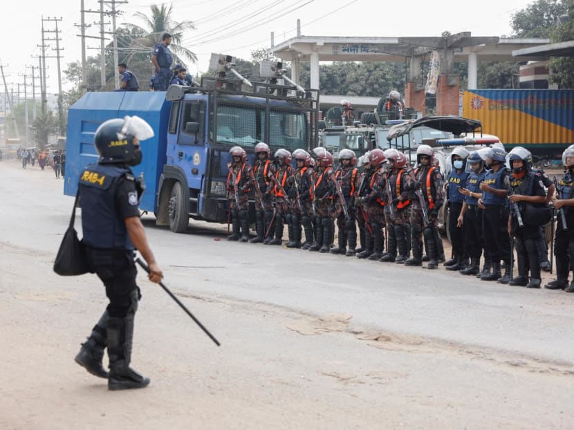 Security forces remain vigilant in front of the garment factories, following clashes between garment industry workers and police over pay, at the Ashulia area, outskirts of Dhaka, Bangladesh on Nov 8, 2023. Security forces remain vigilant in front of the garment factories, following clashes between garment industry workers and police over pay, at the Ashulia area, outskirts of Dhaka, Bangladesh on Nov 8, 2023.