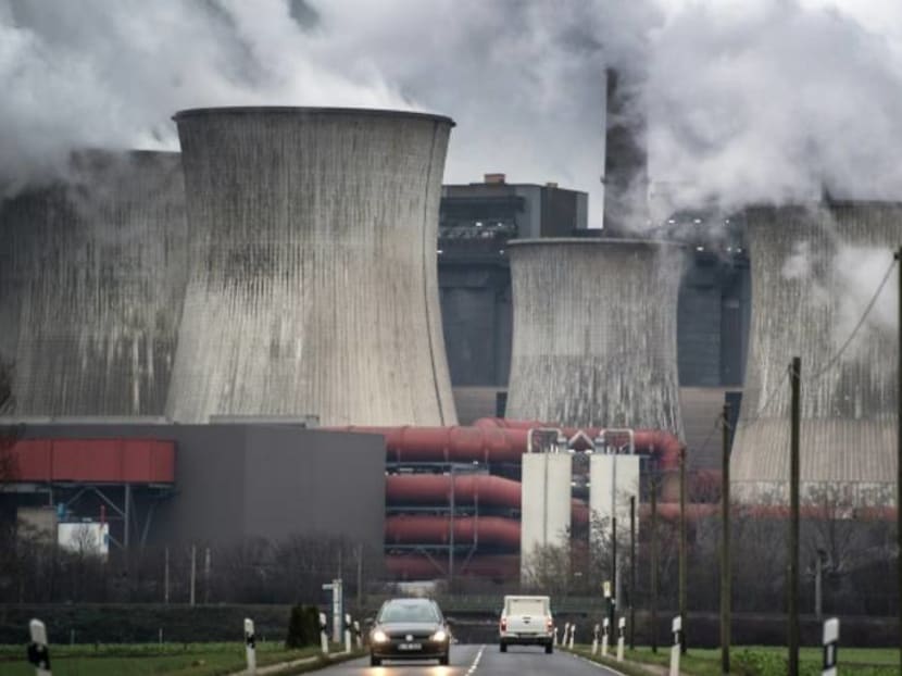 Explainer: Mitigation efforts for a world warming by less than 2 degrees 