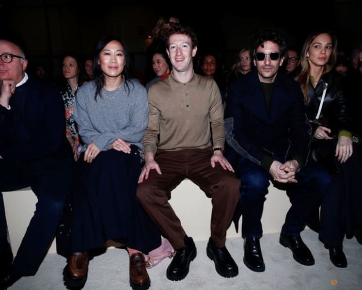 Prada layers winter jackets over light dresses at Milan show as Zuckerberg's presence fuels smart glasses talk