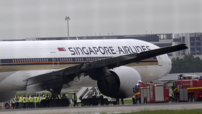 As flames rose, some Singapore Airlines passengers screamed 'Let us out!'