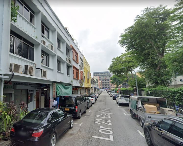 Two men charged after 39 people, including migrant workers, found living in 2 shophouses