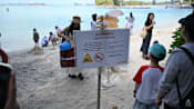 Beachgoers disappointed after crocodile sighting halts water activities at Sentosa beaches 
