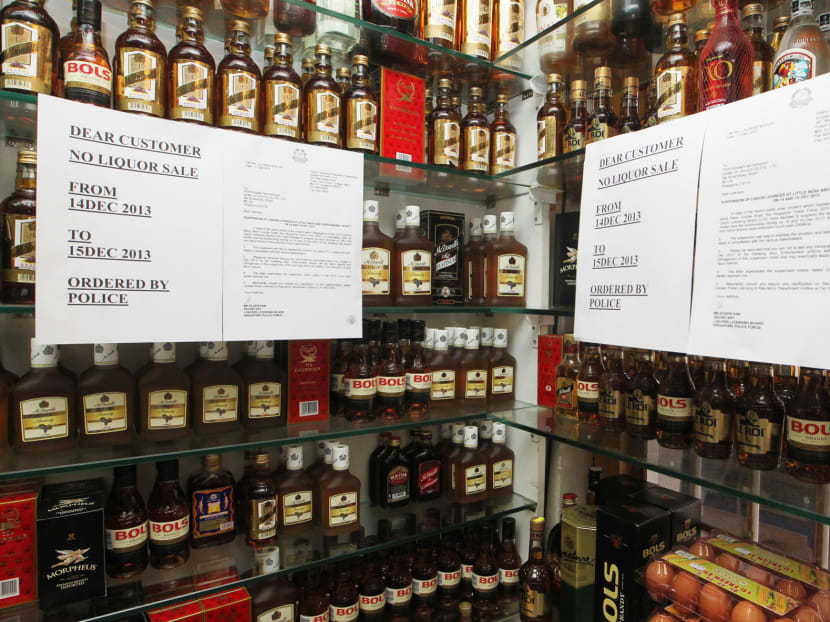 A shop in Little India has put up notifications of a two-day ban in the sale and consumption of alcohol in Little India on shelves displaying alcoholic drinks on Dec 13, 2013. Photo: Ooi Boon Keong