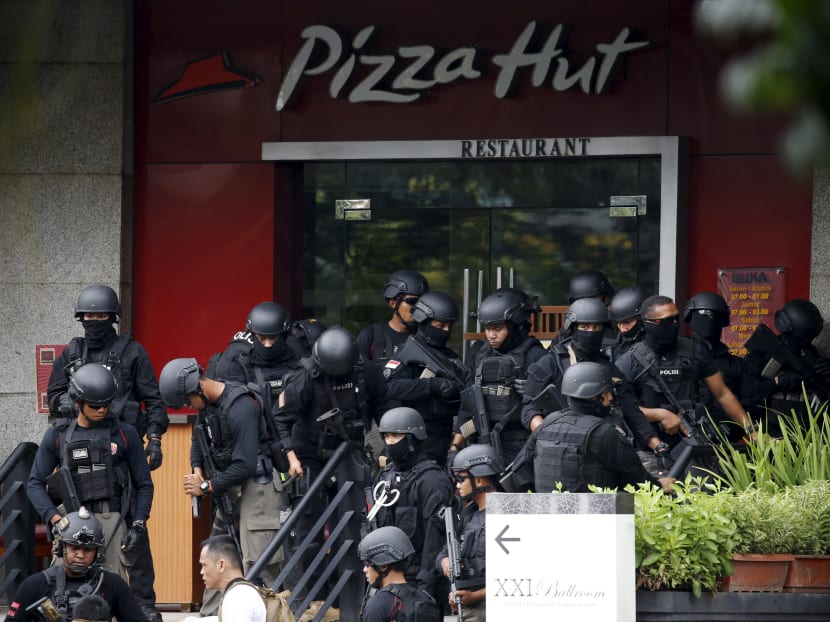 Seven dead in Jakarta blasts, gunfight