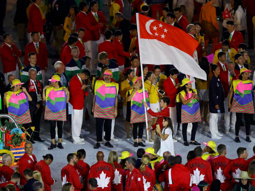 Badminton player and flagbearer Derek Wong leading Team Singapore at the opening ceremony of the 2016 Rio Olympics.There is a need for NS and Singapore's sporting culture to coexist and hopefully thrive and find synergies, says the author.