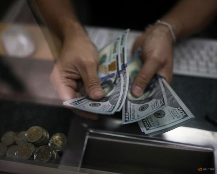 Dollar falls to four-year low vs euro with Fed rate decision on tap