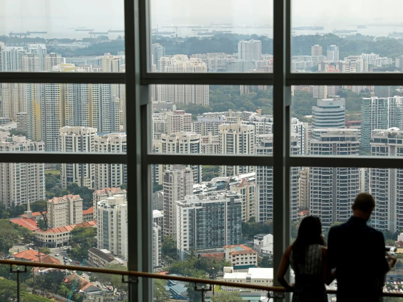 <p>People stand in front of a view of public housing and private residential condominiums in Singapore.</p>
<p>People stand in front of a view of public housing and private residential condominiums in Singapore.</p>