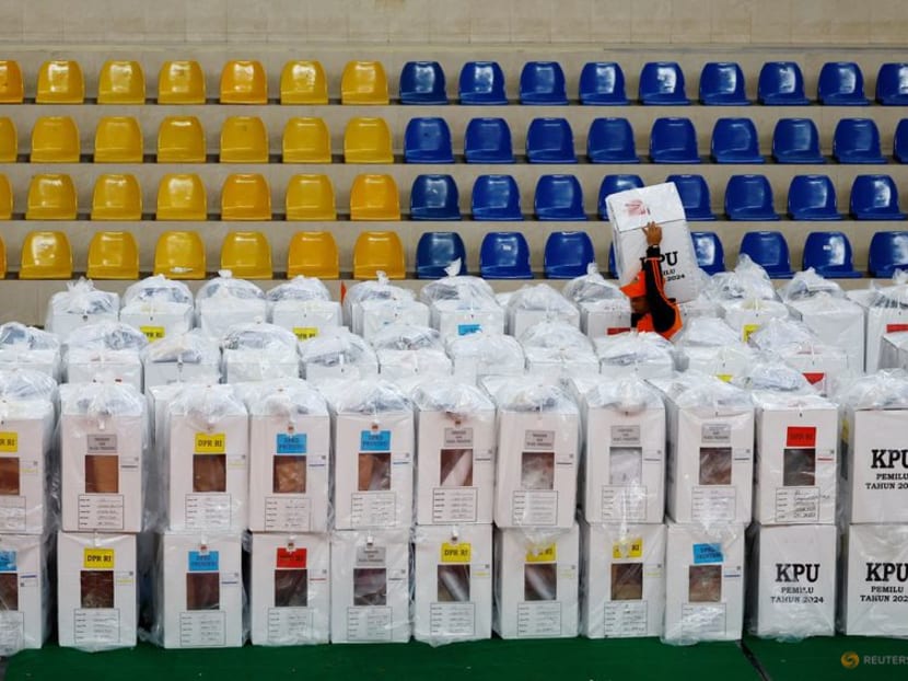A worker carries a ballot box for distribution to polling stations at a distribution centre ahead of the presidential election in Jakarta, Indonesia, on Feb 13, 2024. 