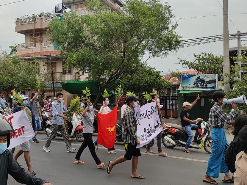 This photo taken and received courtesy of an anonymous source via Facebook on April 17, 2021 shows protesters marching during a demonstration against the military coup in Mandalay, Myanmar.