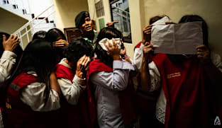 Indonesia baby trafficking trial begins for 19 people accused of sending at least 10 newborns to Singapore