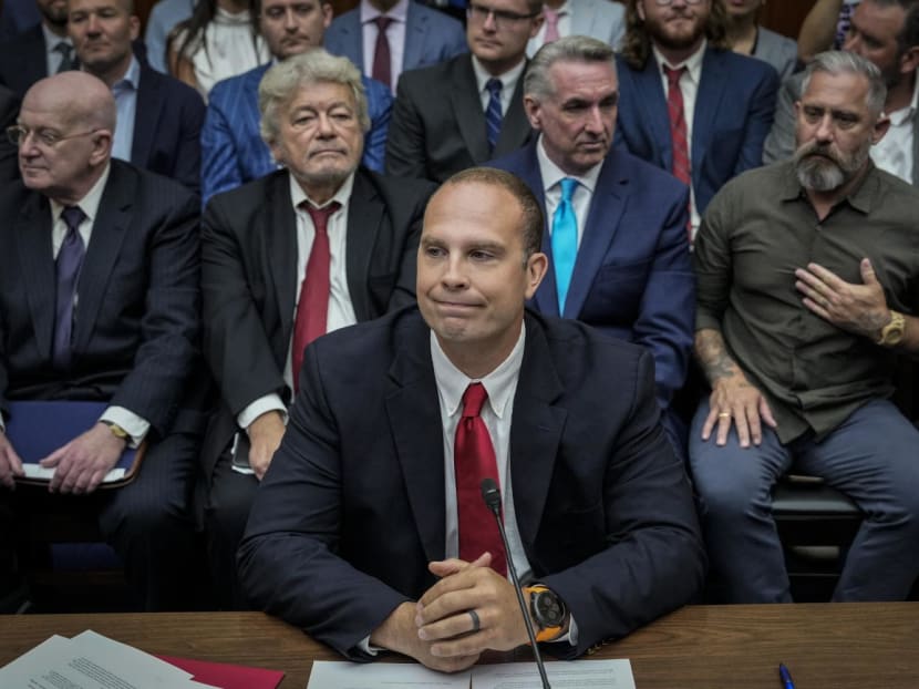 David Grusch, former National Reconnaissance Officer Representative of Unidentified Anomalous Phenomena Task Force at the US Department of Defense, takes his seat as he arrives for a House Oversight Committee hearing on July 26, 2023.