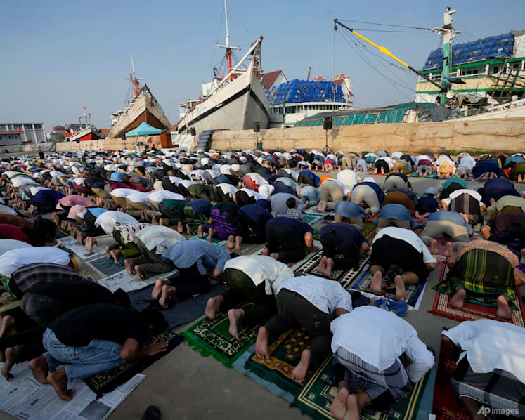 Muslims mark Eid al-Fitr holiday with joy, worry