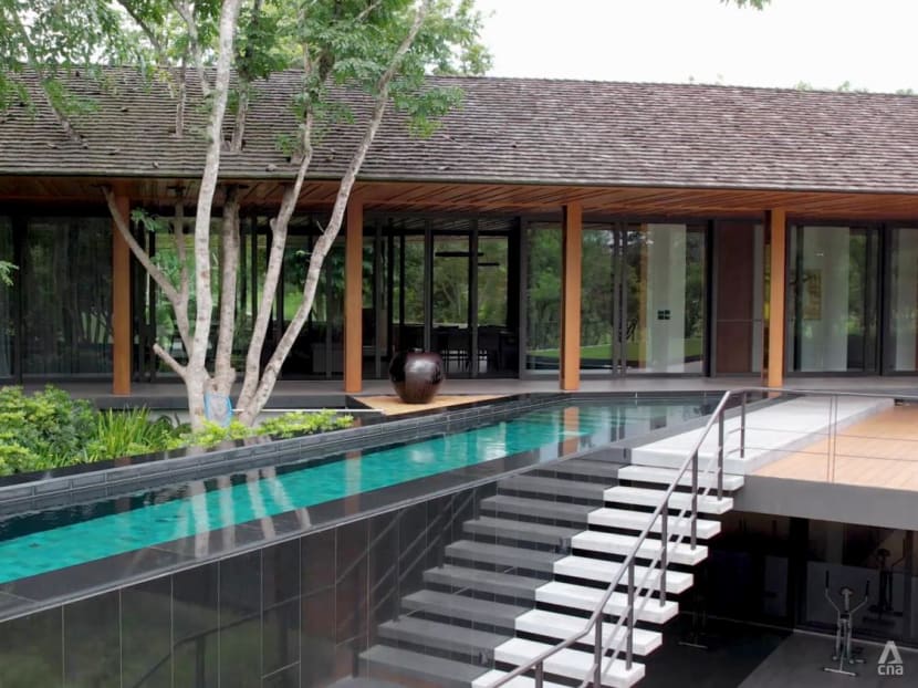 A swimming pool takes centre stage at this tropical modernist architecture in Thailand
