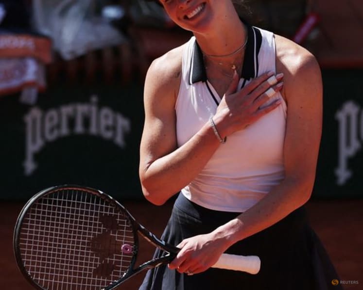 Svitolina huffs and puffs into French Open round two