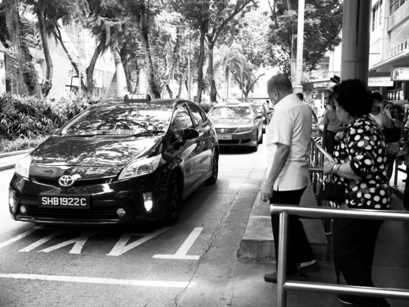 A SMRT taxi in the queue at Lucky Plaza.From Wednesday, Grab will offer dynamic but upfront fares to passengers under the name JustGrab. Photo: Koh Mui Fong