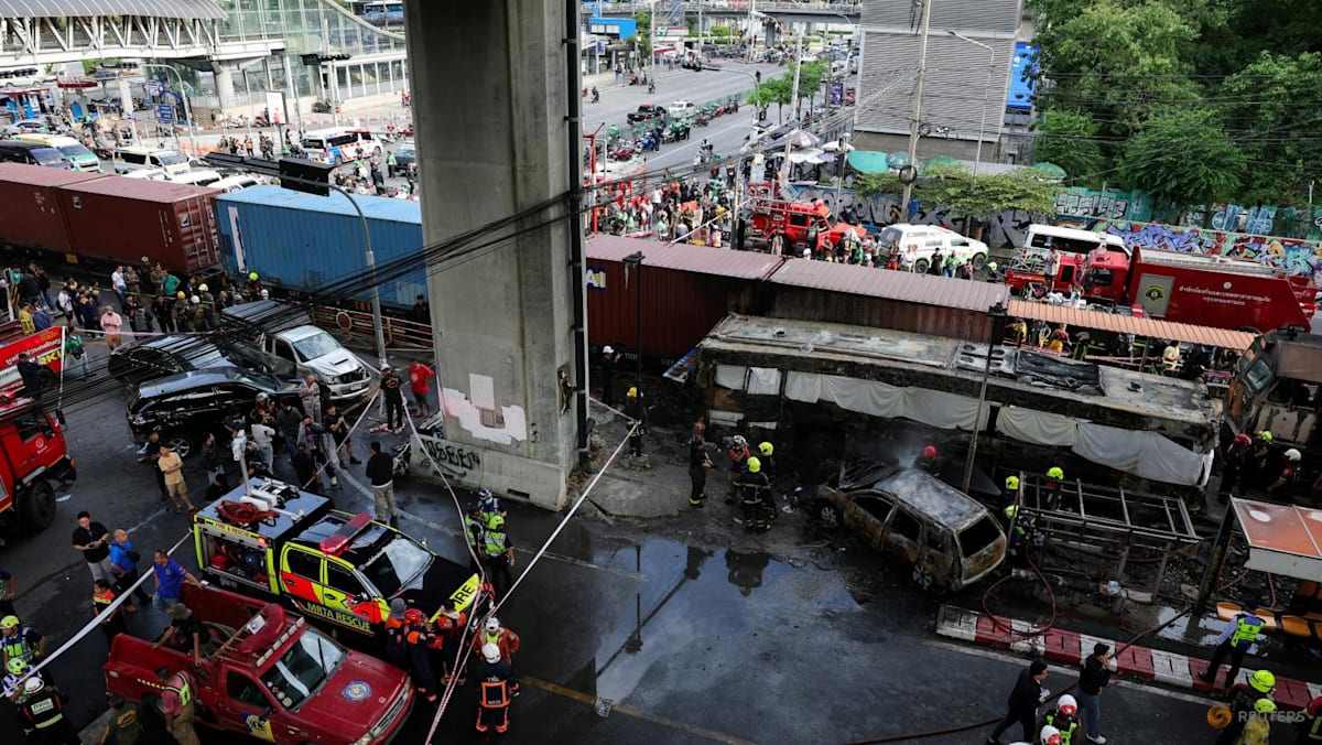 At least eight dead, 25 injured in train collision that sparks bus fire in Bangkok