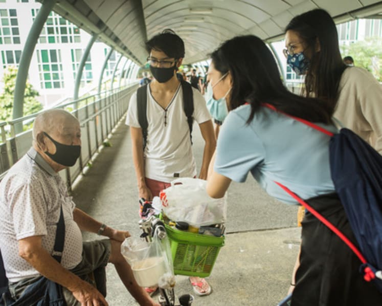 They sell tissue-paper packs out of need. Yale-NUS students now striving to make them a ‘visible community’