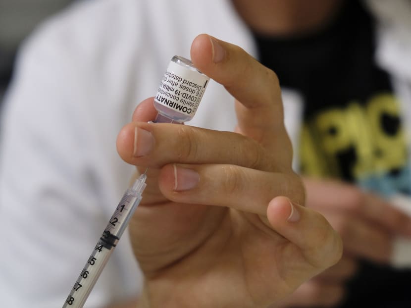 A nurse prepares a dose of the Comirnaty vaccine by Pfizer-BioNTech in a vaccination centre in Noumea, in the French Pacific territory of New Caledonia, on Sept 7, 2021.