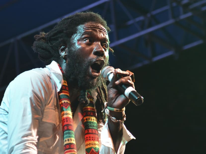 Jamaican singer Jah Bouks, whose given name is Warin Smith, entertains the crowd at a show organised by the Jamaica Reggae Industry Association during the island's "reggae month," in Kingston, Jamaica. Photo: AP
