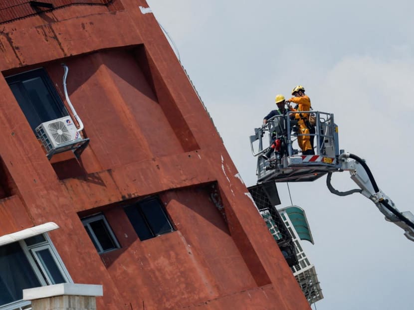 Workers at the site where a building collapsed in Hualien, Taiwan on April 4, 2024.