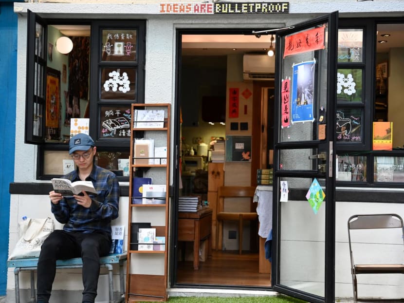 This photo taken on Feb 29, 2024 shows a man reading a book outside independent bookstore 'Mount Zero' in Hong Kong. This photo taken on Feb 29, 2024 shows a man reading a book outside independent bookstore 'Mount Zero' in Hong Kong.