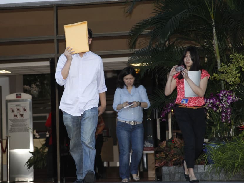 CPIB Officer, Edwin Yeo who is facing fraud charges, leaves the Subordinate Court after he managed to post bail..Photo: Ernest Chua. 24 July 2013.