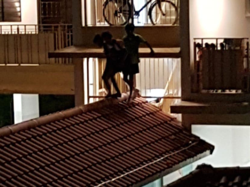 Youths seen on the rooftop of a walkway at Block 438 Yishun Ring Road in June last year. Photo credit: Tan Sook Leng