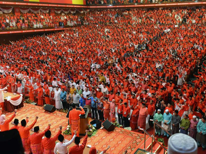 Umno president Ahmad Zahid Hamidi and party members at its general assembly.
