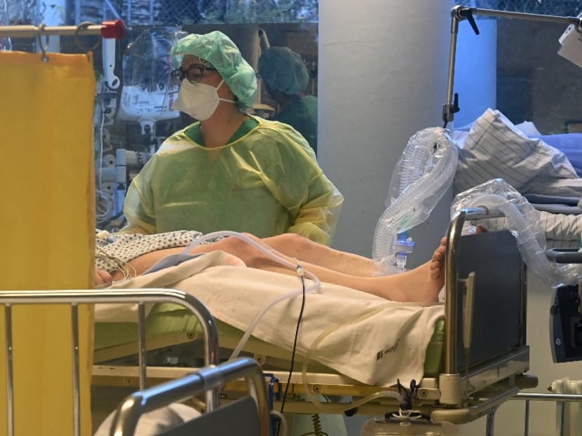 Medical personnel works at the intensive care unit with Covid-19 patients in a hospital in Freising near Munich, southern Germany, on Nov 16, 2021, amid the ongoing Covid-19 pandemic. Medical personnel works at the intensive care unit with Covid-19 patients in a hospital in Freising near Munich, southern Germany, on Nov 16, 2021, amid the ongoing Covid-19 pandemic.