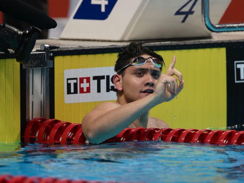 Joseph Schooling stormed home in a new Games record time of 51.04sec in the men's 100m butterfly final on Wednesday (Aug 22) to finish in top spot.