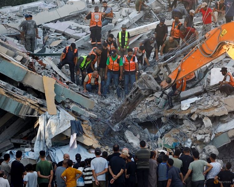 War-damaged Gaza building collapses killing 12 people seeking shelter inside