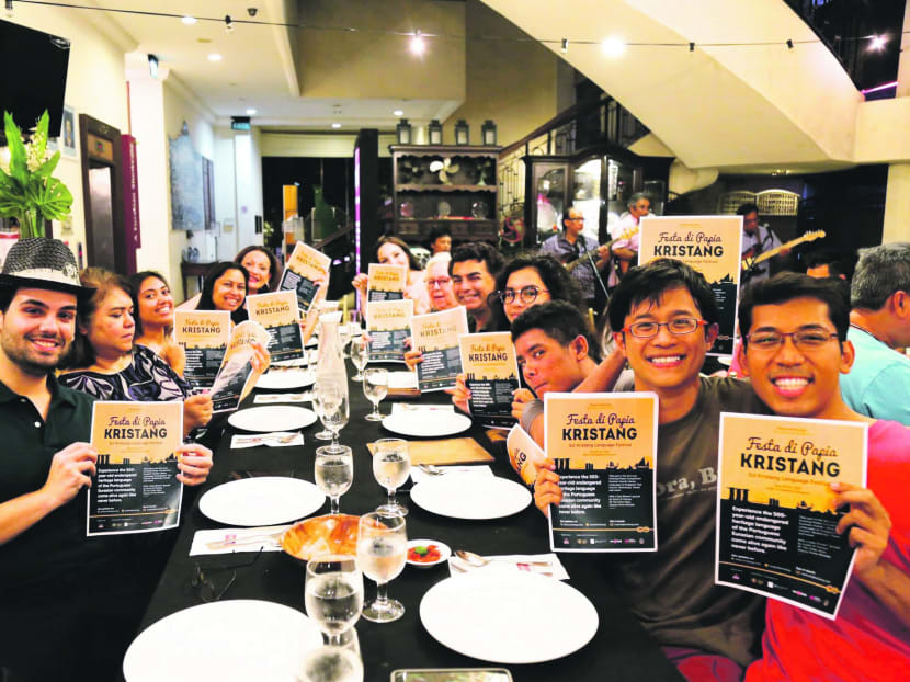 The organisers and volunteers with the promotional material for Singapore's first festival for the fast disappearing heritage language of the Portuguese-Eurasian community known as Kristang. Photo: Sandra Galistan