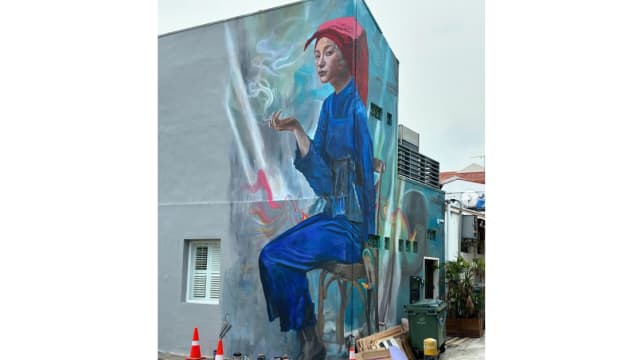 红头巾壁画惹议！市建局要求移除画上香烟