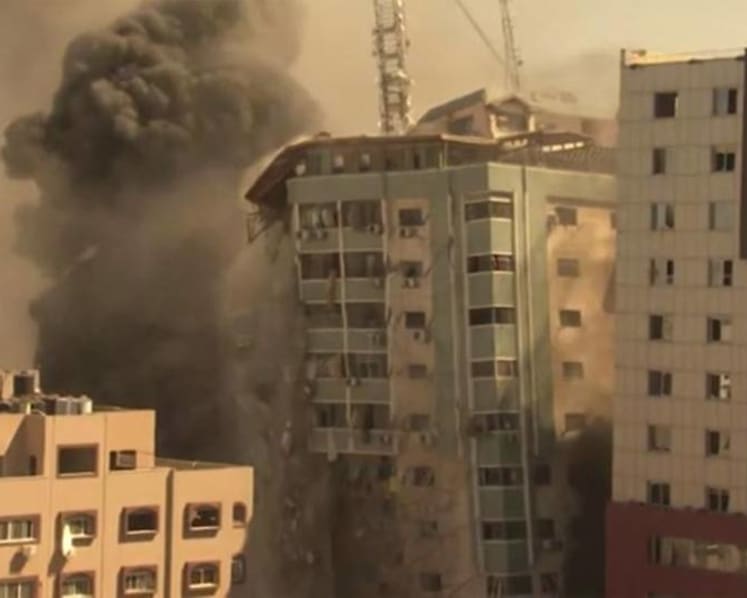 Israel strike in Gaza destroys building housing AP, Al Jazeera 