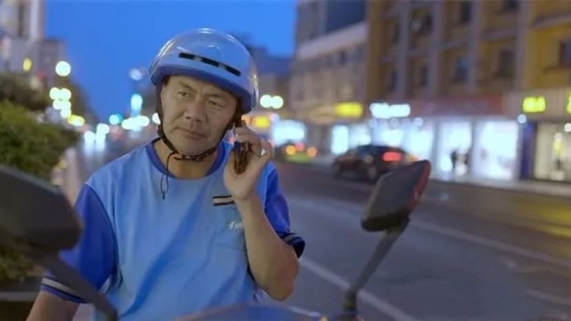 'Flying low is still flying': Food delivery rider wins China's top literary prize