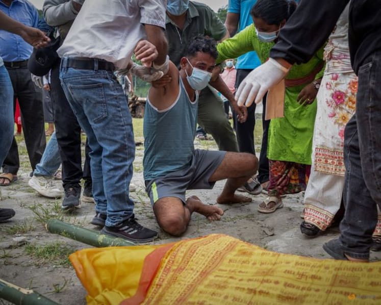 Nepali families hold symbolic funerals for missing after floods