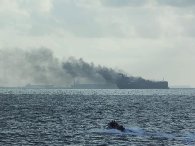 RSS Supreme's rigid inflatable boat approaching a liferaft in vicinity of the burning vessels on July 19, 2024.