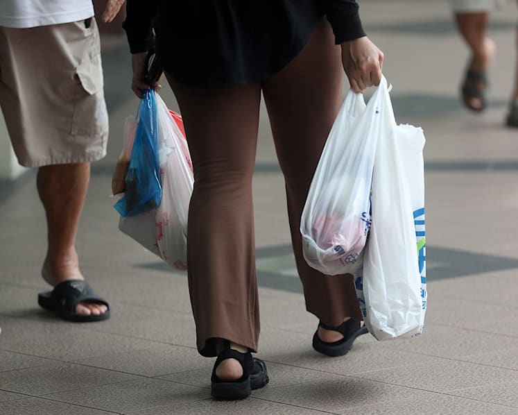 Plastic bag use at supermarkets has dropped by up to 80% since mandatory charge