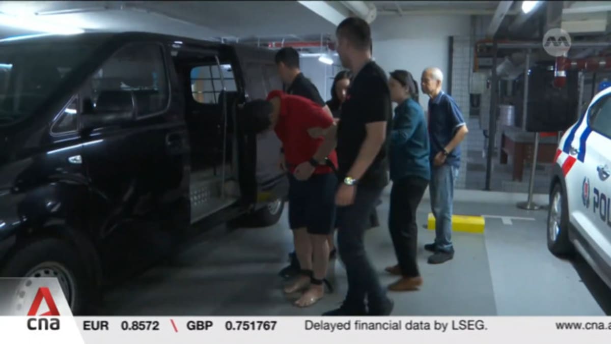 Indonesian accused of murdering his wife in Singapore hotel brought back to crime scene